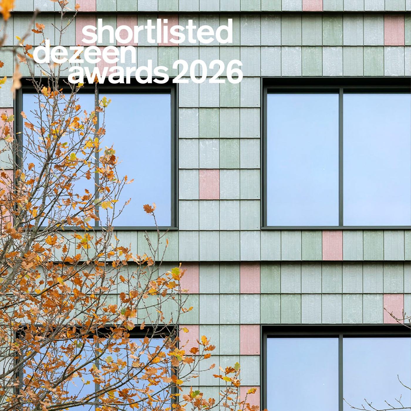 Facade clad in green and pink Basic Third tiles made from recycled PVC by Pretty Plastic, with the Dezeen Awards 2026 shortlisted logo
